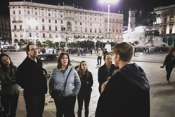 Milan Dark Ghost Tour on Foot - Duomo di Milano at night: white-eyed figures and wedding-day photos