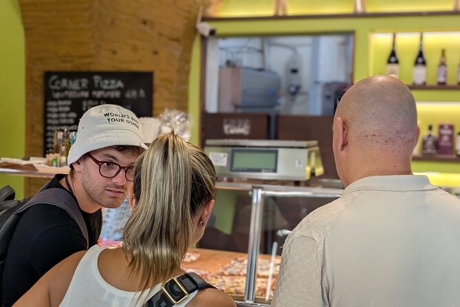 Rome Secrets with Dark History and Tasty Bites Tour Experience - Via dei Giubbonari: a cheerful street with a scary sidebar